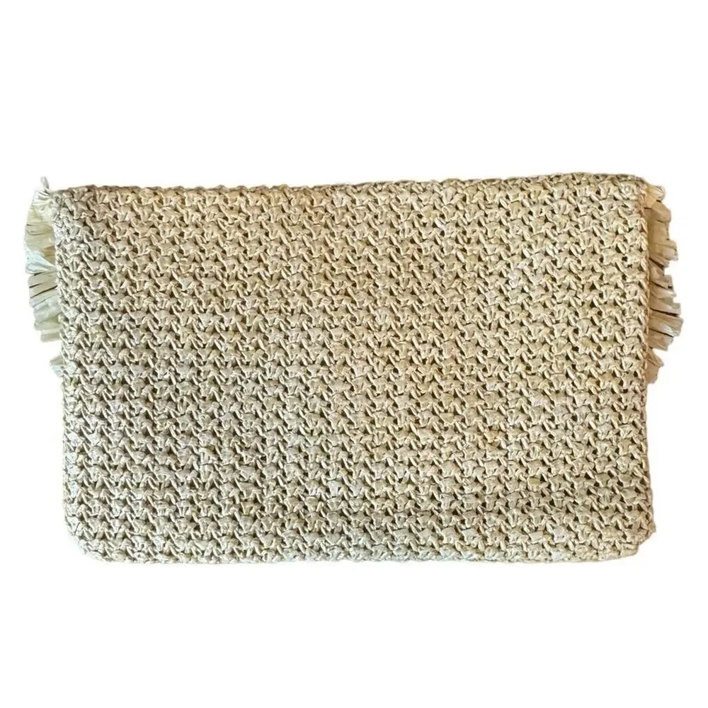 The North Shore Natural Frayed Tassel Clutch